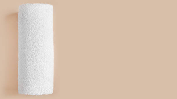 istock White towel. On a beige background 1502534703