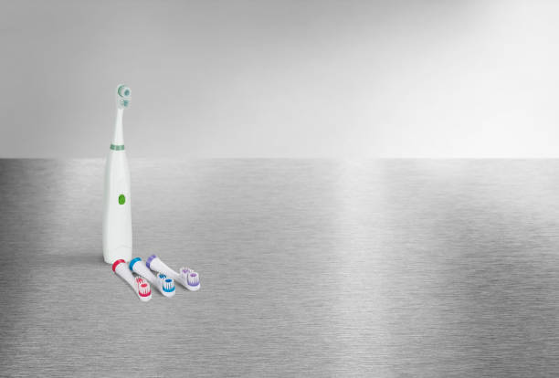 istock Electric toothbrush set on a metallic surface 1502535459