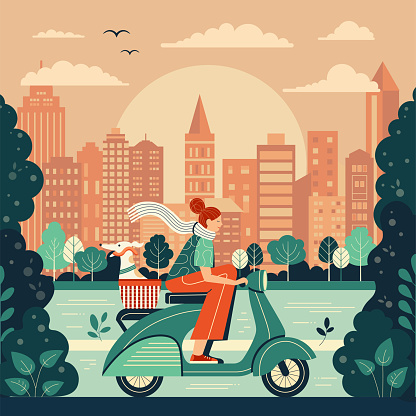 Girl riding retro green scooter with excited Italian greyhound in basket. Woman driving vintage motorbike with dog in pet carrier. Female exploring city park along river with cityscape on background.