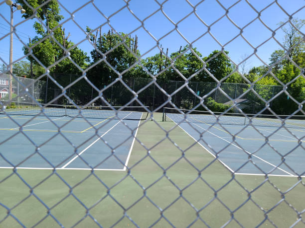 istock Fence Along Tennis Court 1502536925