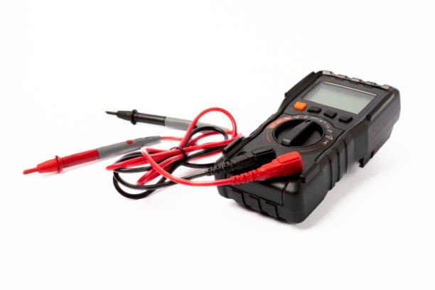 istock Black digital multimeter with probes isolated on white background. Multimeter is an electronic measuring instrument. Business and profession electrician. Electric concept tool. 1502540120