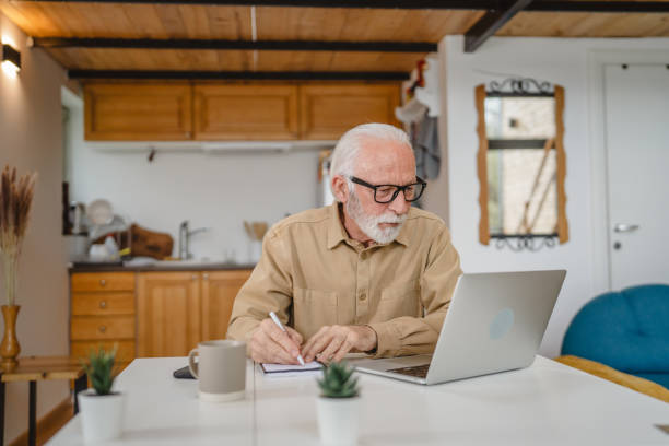 istock One senior caucasian man work on laptop use computer at home 1502546731