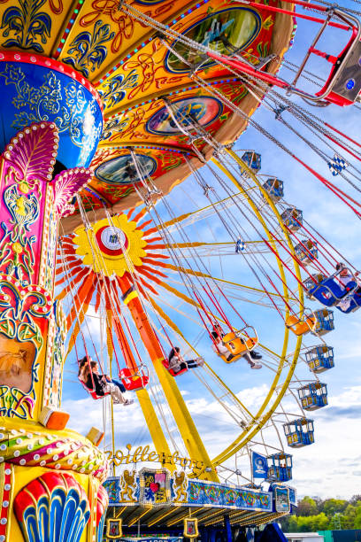Munich, Germany - April 23: typical chain carousel and decoration at the annual spring festival (Frühlingsfest) in Munich on April 23, 2023