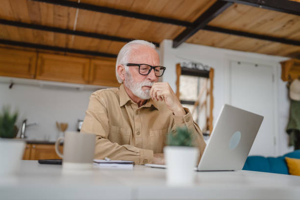 istock One senior caucasian man work on laptop use computer at home 1502548546