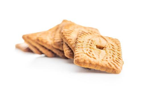 Sweet caramel biscuits. Tasty cookies isolated on the white background.
