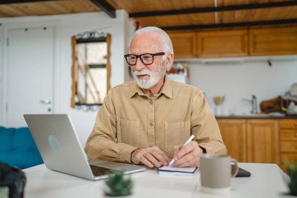 istock One senior caucasian man work on laptop use computer at home 1502557634