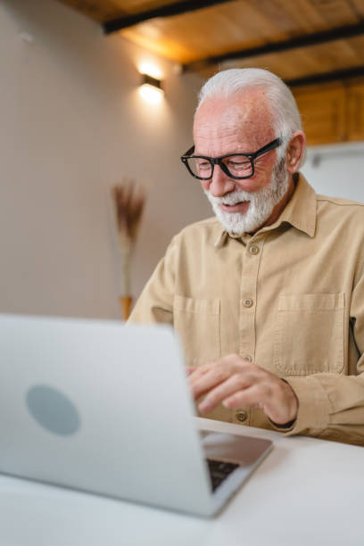 istock One senior caucasian man work on laptop use computer at home 1502558236