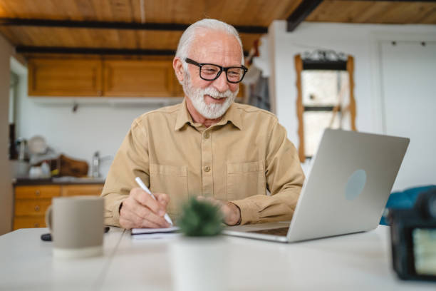istock One senior caucasian man work on laptop use computer at home 1502558330