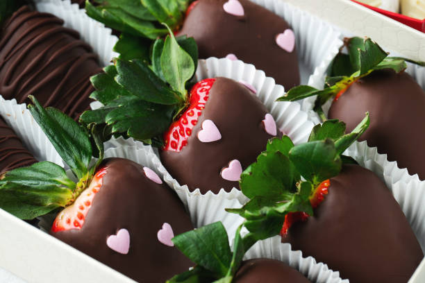 istock Gourmet chocolate covered strawberries on the light background. 1502558956