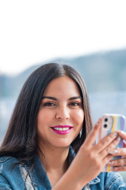 istock latina girl checking her phone 1502560372