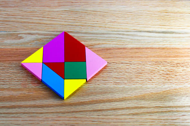 Puzzle with wooden figures of different colors