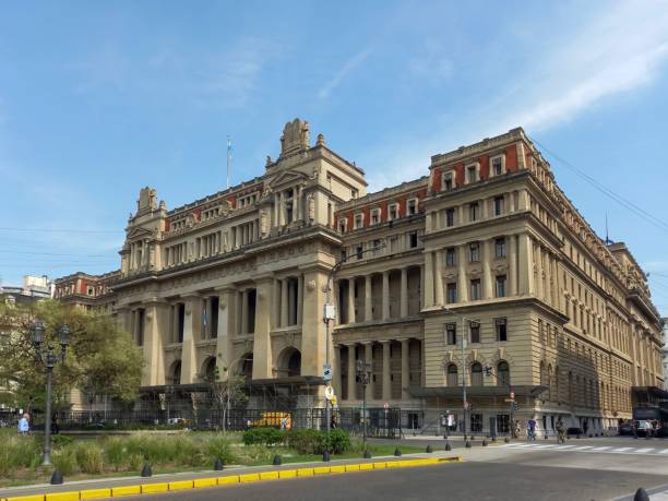 Low angle view of the palace of justice in brussels, belgium, with sunlight creating a lens flare