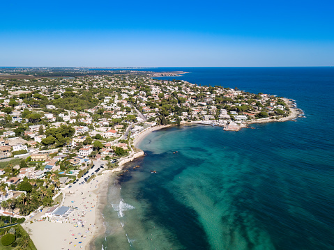 Italian city and coastal beach photographed by drone. Syracuse, Sicily.