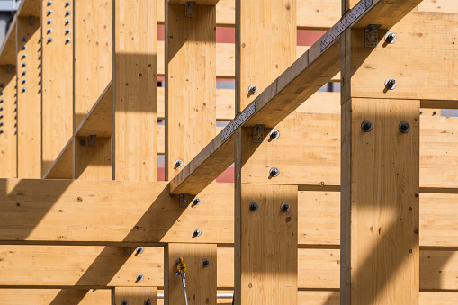 Construction of new wooden house. Beams frame close up