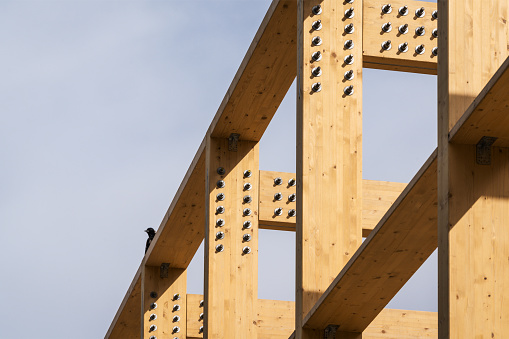 Construction of new wooden house. Beams frame close up