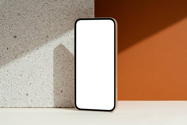 Blank screen smartphone mockup on brown background stock photo