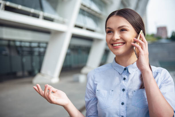 istock Beautiful business lady with gadget 1502567008