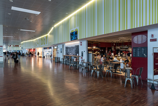 Tokyo, Japan - February 20, 2018: Tokyo International Narita Airport interior. Departure Area with People and Coffee Shops. Japan