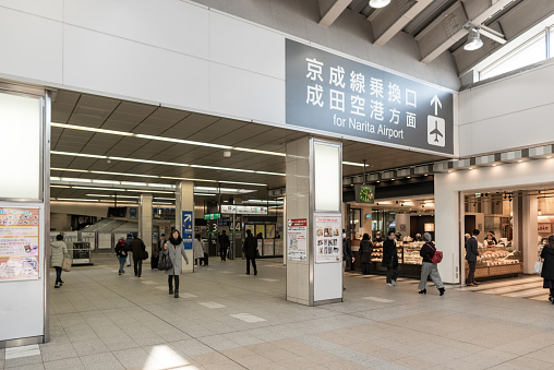 Tokyo, Japan - February 20, 2018: Tokyo Nippori Subway Metro Station with People and Direction to Narita Airport