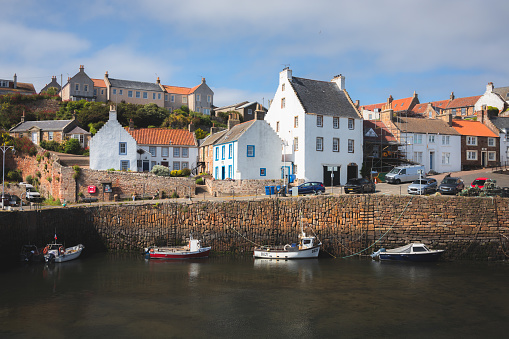 Crail, UK - June 9 2023: The quaint and picturesque harbour of the seaside fishing village Crail on a sunny summer day in East Neuk, Fife, Scotland.