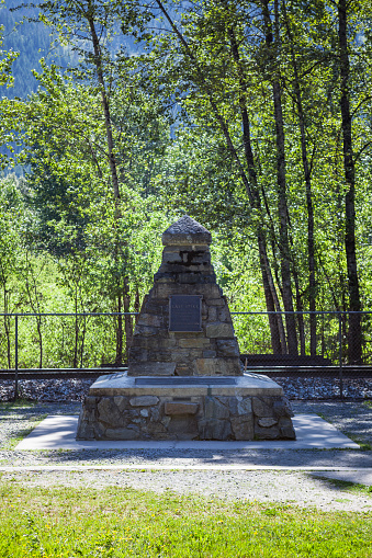 Craigellachie, British Columbia, Canada - June 5, 2023. The Canadian Pacific Railway (CPR) Last Spike monument at Craigellachie, BC, Canada.
