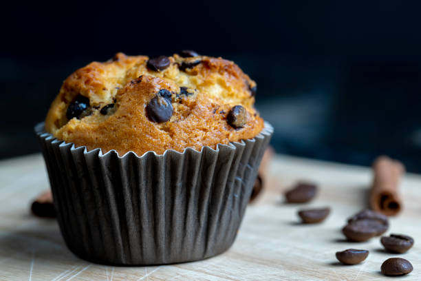 istock Cupcake with chocolate pieces, close up 1502569502