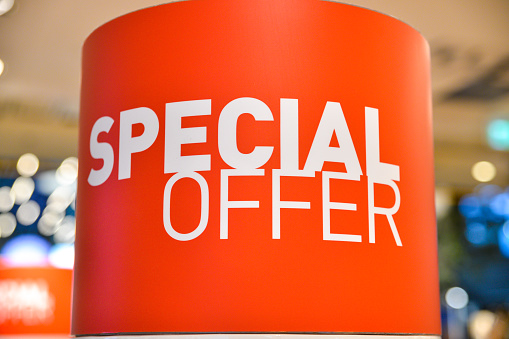 Special offer signage in discount shop, as austerity bites customers search for bargains in the shops