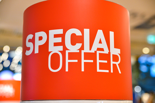 Special offer signage in discount shop, as austerity bites customers search for bargains in the shops.