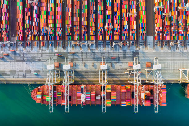 istock Cargo commercial port. View from a drone. Containers for transporting goods. Cargo sea transport. View from above. Loading the ship containers.  Industry and trade. 1502573058