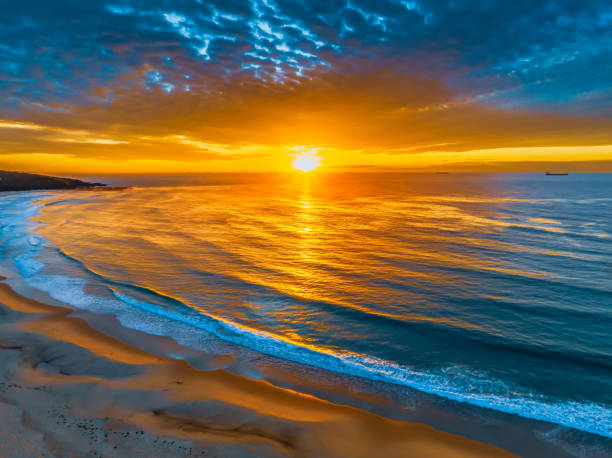 istock Sunrise at the seaside with beautiful cloudcover 1502577800