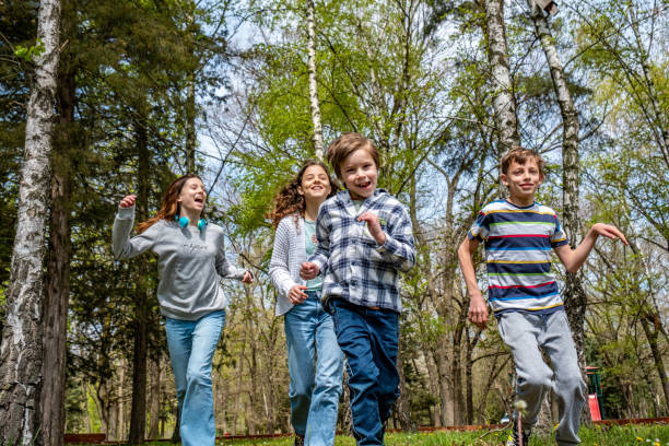 istock song children run on the grass 1502582387