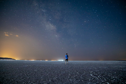 A man watching the Milky Way in the Salt Lake at night