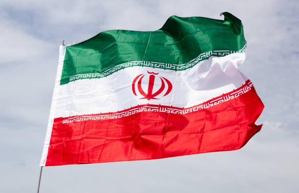 istock Flag of Iran waving on cloudy sky during daytime 1502631045