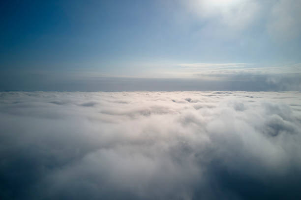 istock Aerial view from high altitude of earth covered with puffy rainy clouds forming before rainstorm 1502635529