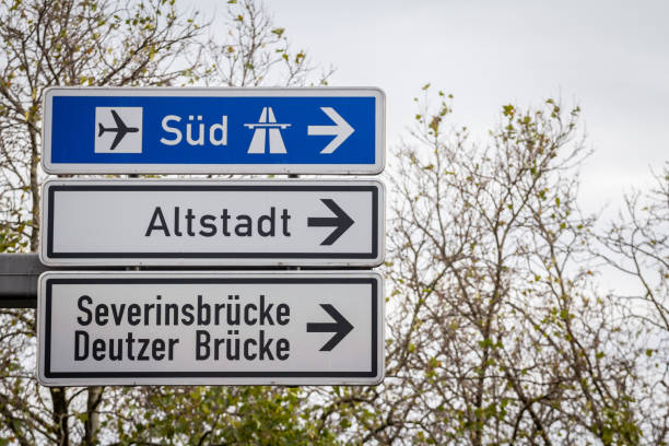istock Selective blur on german roadsign in Cologne, Germany, directing to autobahn motorway heading south (Sud in German) & local road to Cologne districts of Severinsbrucke, Altstadt & Deutzer Brucke. 1502636155