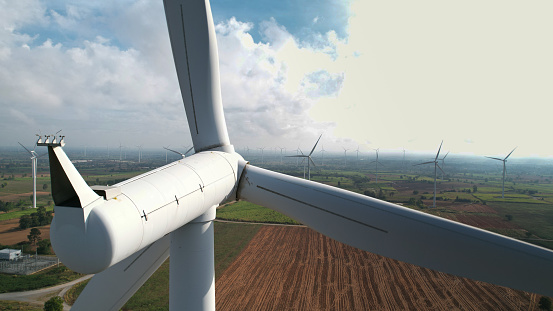 aerial view close-up of wind turbine propeller blades in the field.Wind Energy Concept.Renewable Green Electricity