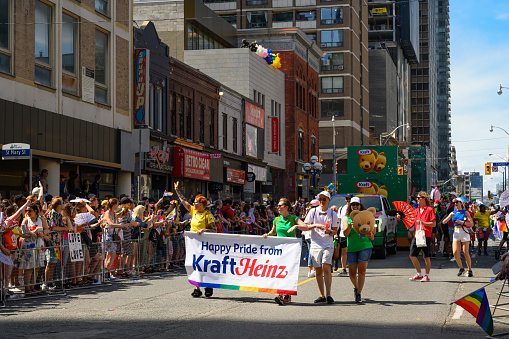 Toronto, Canada - June 25, 2023: Kraft Heinz team celebrates at the Pride Toronto Parade , organized by Pride Toronto, a non-profit organization.