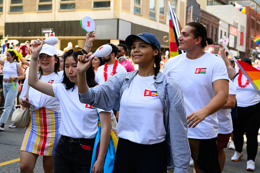 Toronto, Canada - June 25, 2023: Scotia bank team celebrates at the Pride Toronto Parade , organized by Pride Toronto, a non-profit organization.