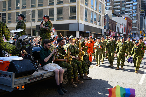 Toronto, Canada - June 25, 2023: Canadian Armed Forces personnel celebrate at the Pride Toronto Parade , organized by Pride Toronto, a non-profit organization.