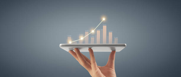 istock Plan graph growth and increase of chart positive indicators ,tablet in hand 1502652368
