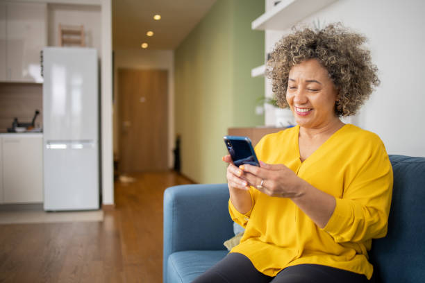 istock Happy mature woman using phone 1502653423