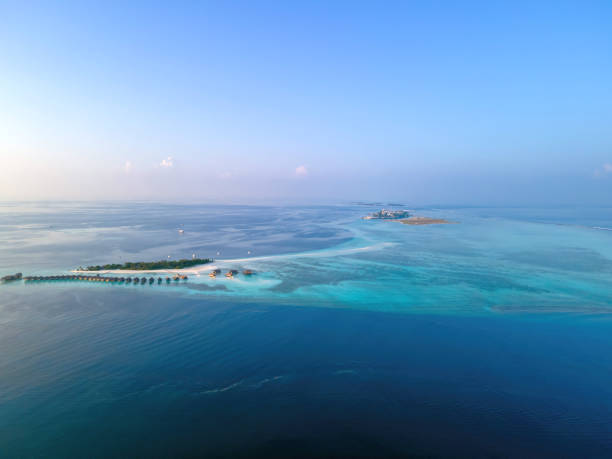 An aerial view of Makunufushi (front) and Maafushi (back) islands stock photo