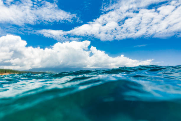 istock Surface view of rippled ocean with storm in the background while swimming 1502654829