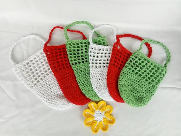 istock Crochet bag handmade white red green, white background texture 1502659585