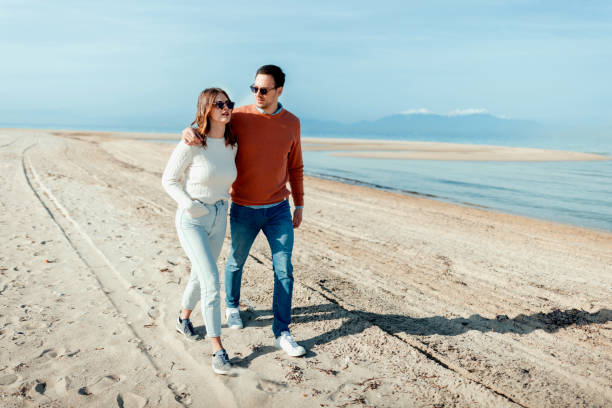 istock Beautiful couple enjoying by the sea 1502663232