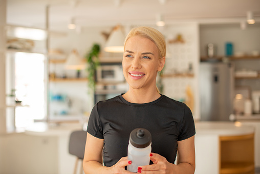 Healthy woman exercising at home