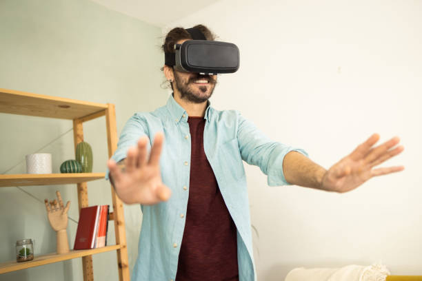 istock Portrait of a young man having fun with 3D glasses 1502673529