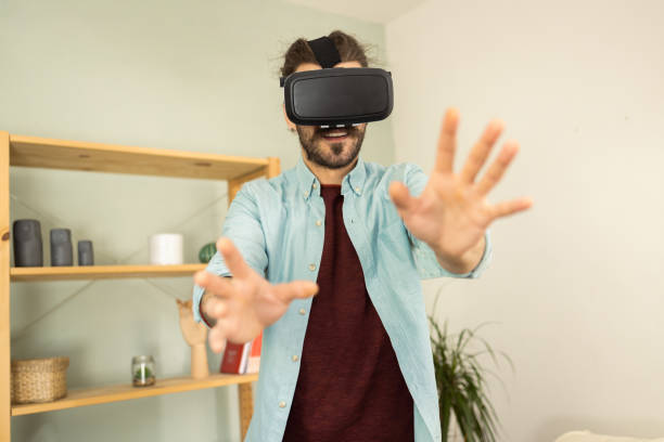 istock Portrait of a man having fun with virtual reality glasses 1502673531
