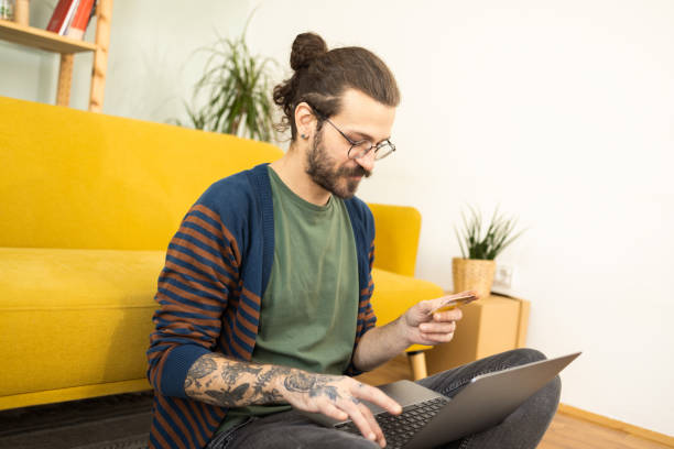 istock Young man making an online payment from home 1502673620