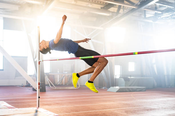 istock Sportsman high jumping through pole 1502674611